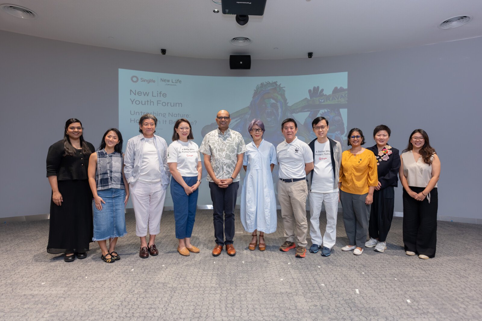 Dr Janil Puthucheary, Senior Minister of State, Ministry of Education and Ministry of Sustainability and the Environment, with panellists, moderator, emcee and organisers at the inaugural New Life Youth Forum at Central Library on 24 October 2026. (From left) Nava Neethasnath, Founder, Togather for Good; Chan Kah Mun, Sustainability Advocate and Storyteller, How Light Falls; Adrian Tan, Founder, Ad Planet Group; Wei Lin Chin, Group Head of People, Singlife; Dr Janil Puthucheary; Tan Shook Wah, Director, Projects, Ad Planet Group; Chew Sutat, Chief Executive Officer, WWF-Singapore; Chia Ko Wen, Head of Sustainability, Singlife; Jayasri Narayanan, Assistant Director, Conservation and Science, WWF-Singapore; Dr Dee Chia, Deputy Director, Audience Development, National Gallery Singapore; and Joline Tang, Founder, The Sustainability Project.